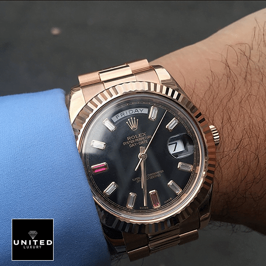 the rolex daydate with the diamond detail on his wrist